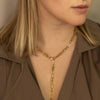Woman wearing the Sol Necklace as a lariat 