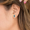 Woman wearing swiss blue topaz and Gold Rectangle Gemstone Glow Studs and Small Stardust Studs