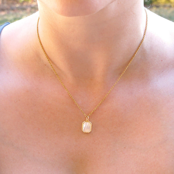 Woman wearing the Mother of Pearl Sunrise Necklace