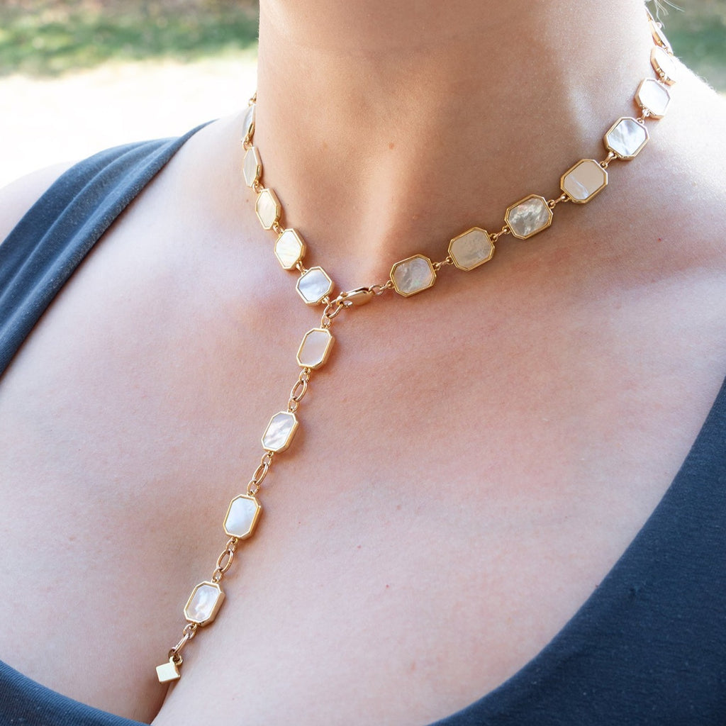 Woman wearing the Mother of Pearl Statement Collar Necklace as a lariat