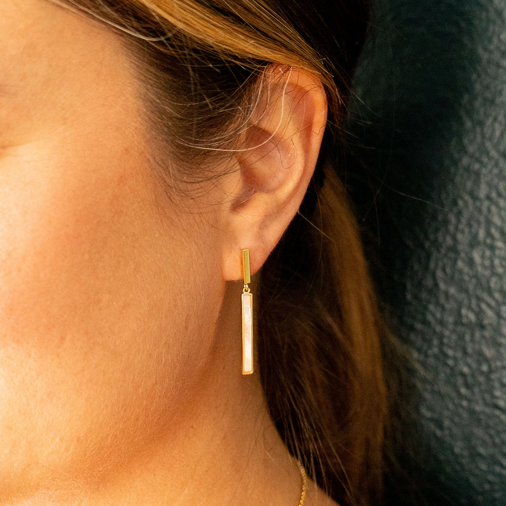 Woman wearing Mother of Pearl Bar Drop Studs