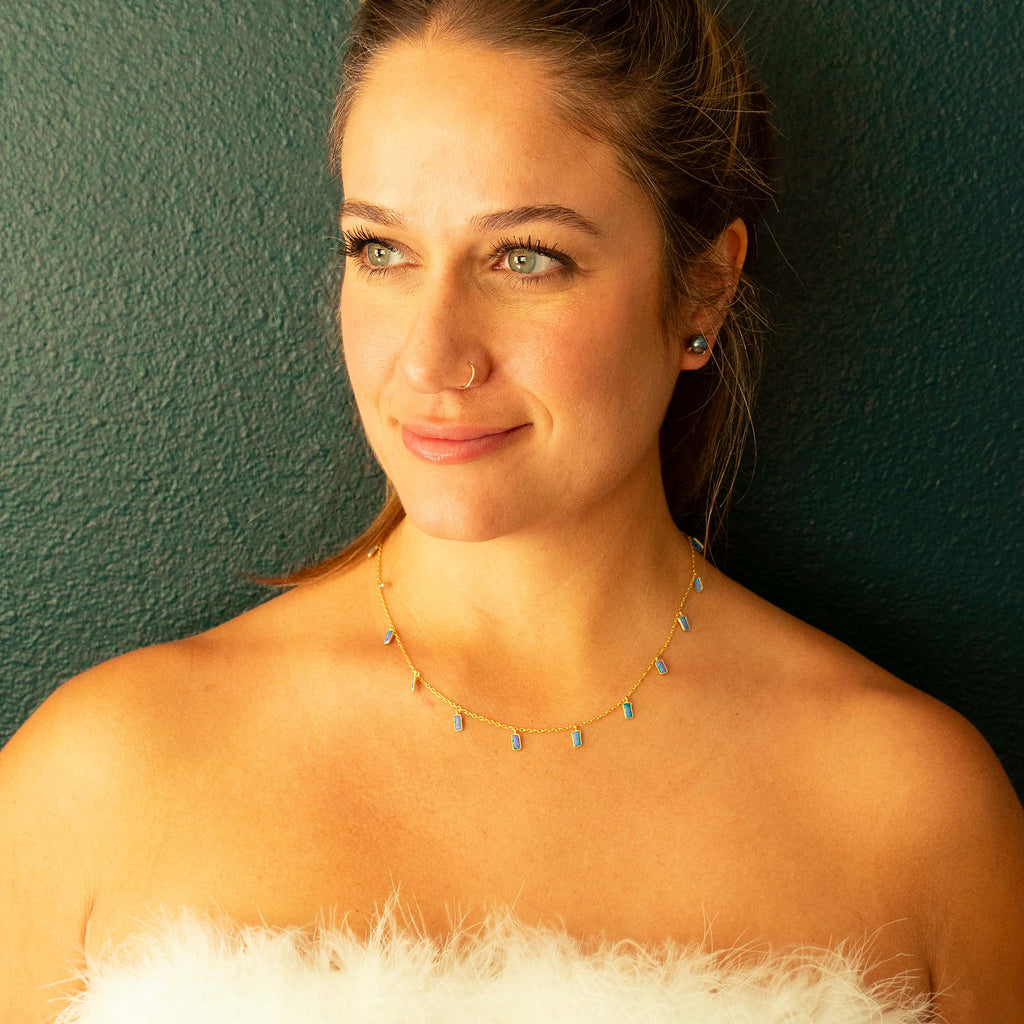 Gold chain with 11 rectangle Blue Opal charms and black pearl earrings