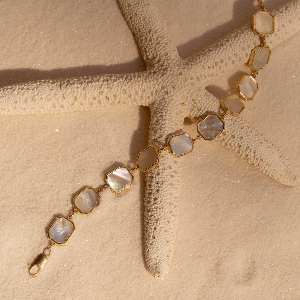 Mother of Pearl Bracelet in the sand on a starfish