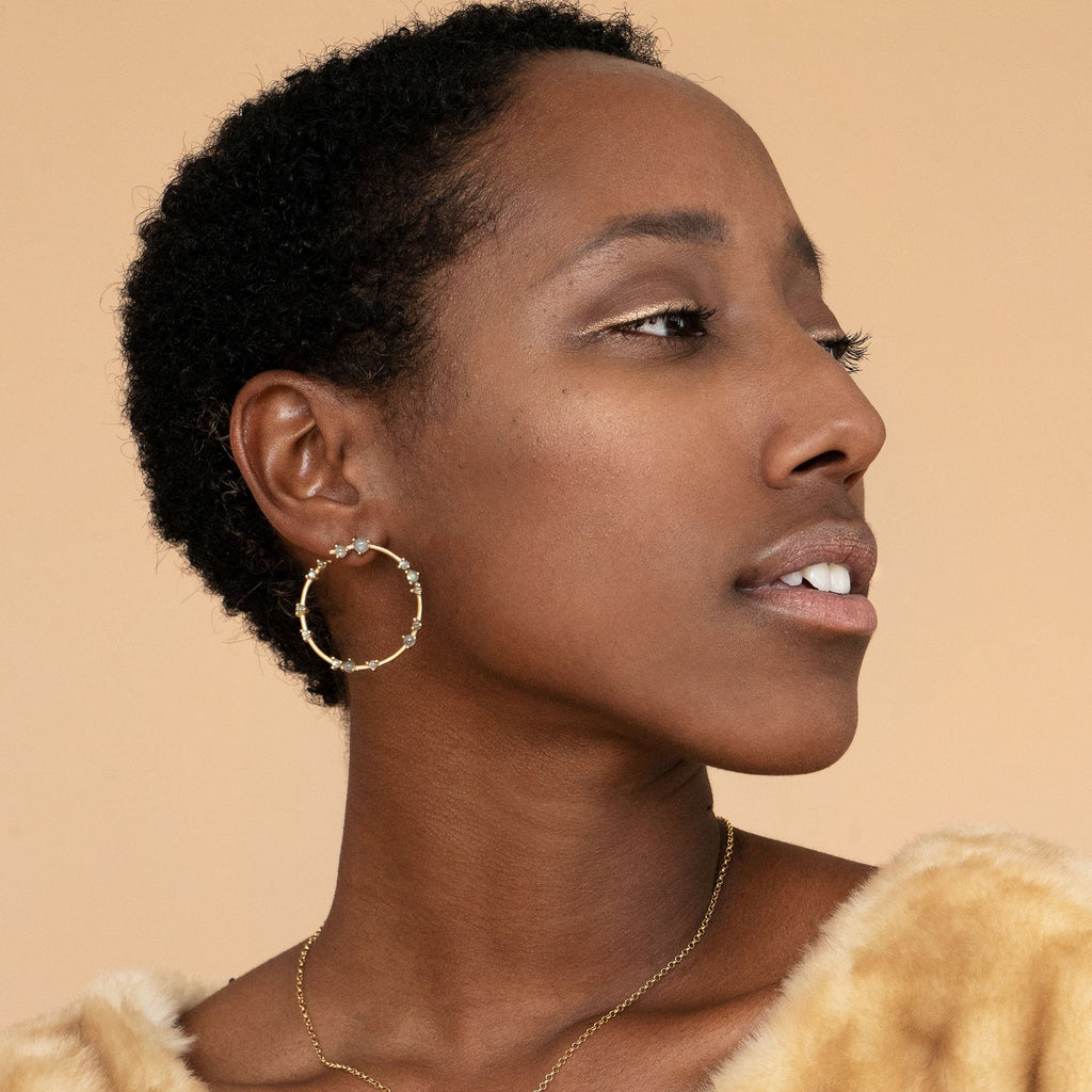 Woman wearing Gold and Labradorite Coeus Hoop Earrings 
