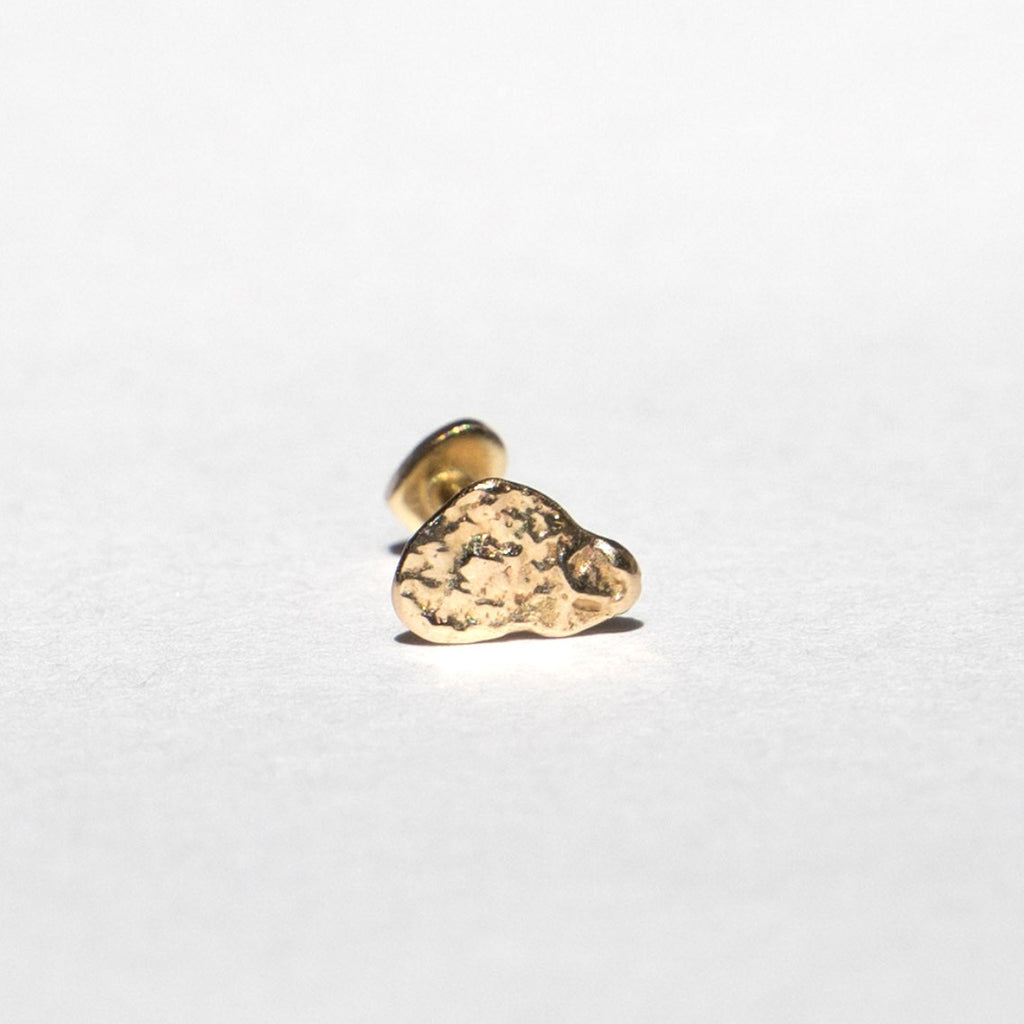 A small gold cloud-shaped stud earring with a textured, hammered finish, shown on a plain white background.