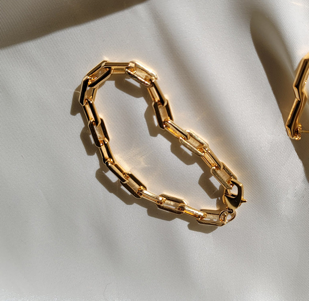 Gold Sol Link Bracelet on satin