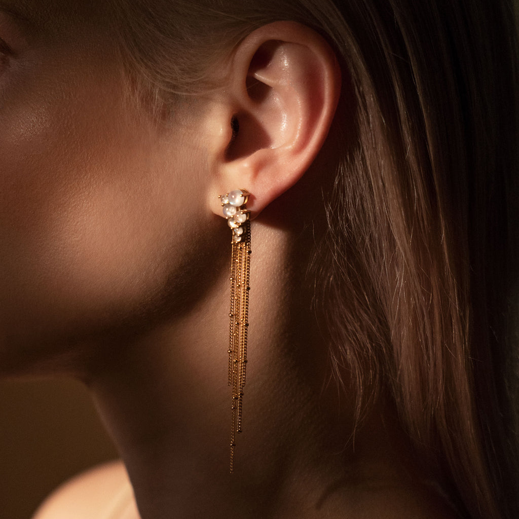 woman wearing Gold Via Lactea Tassel Stud with moonstone