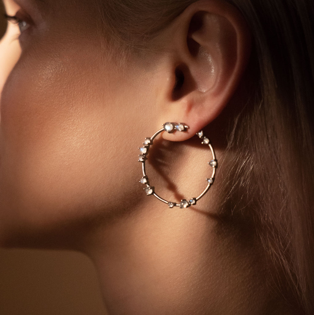 Woman wearing Silver and Moonstone Coeus Hoop Earrings 