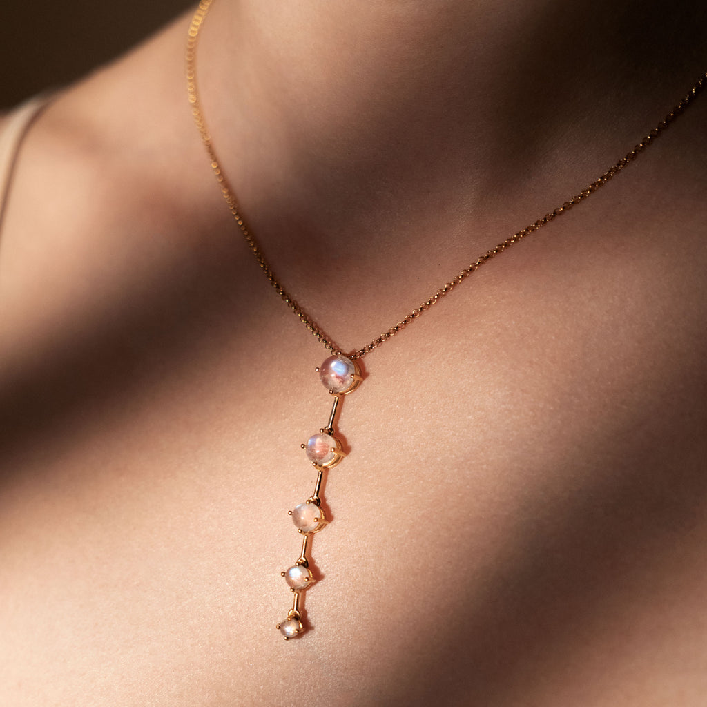 Gold and Rainbow Moontone Astraea Pendant necklace being worn