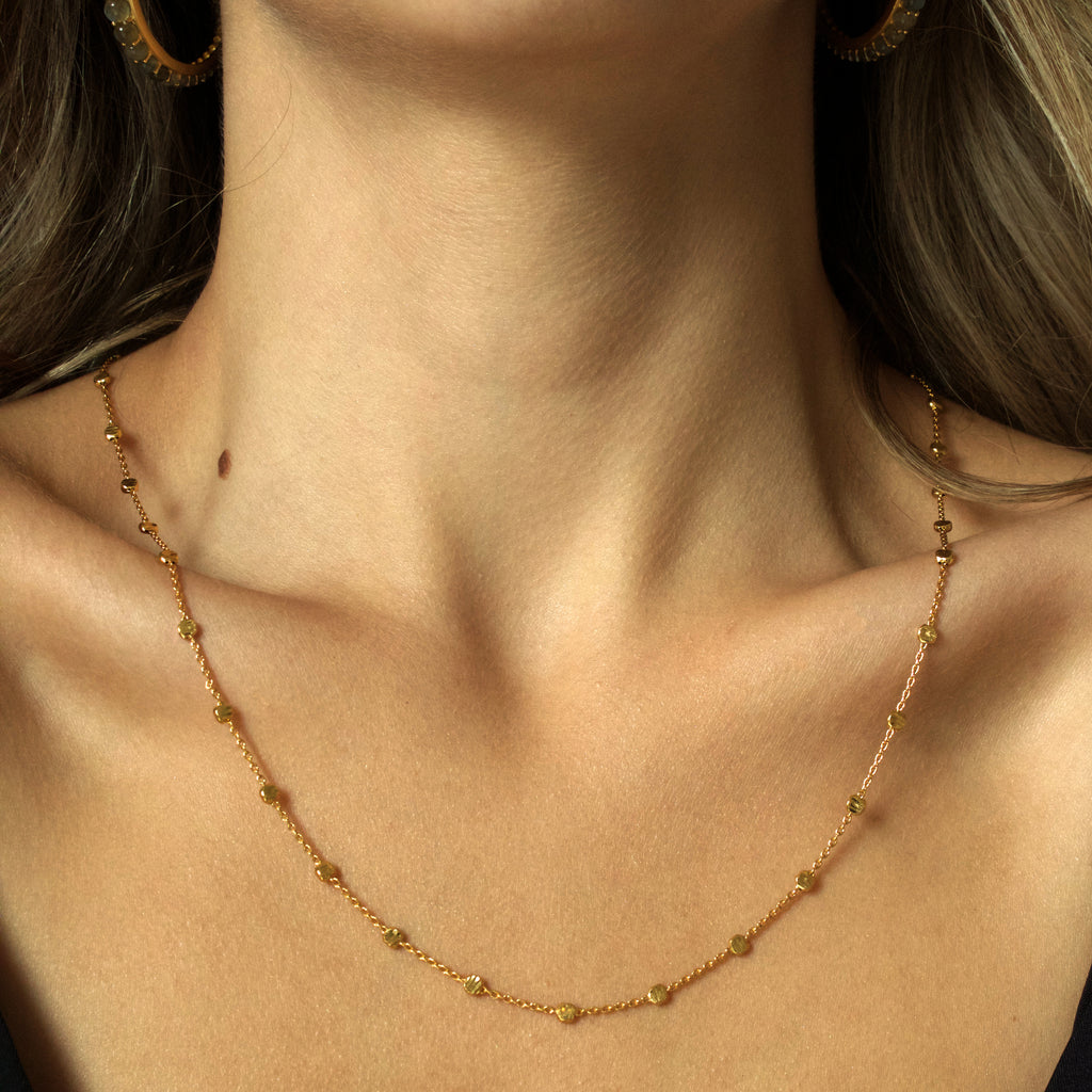 Woman wearing Short gold nebula Necklace