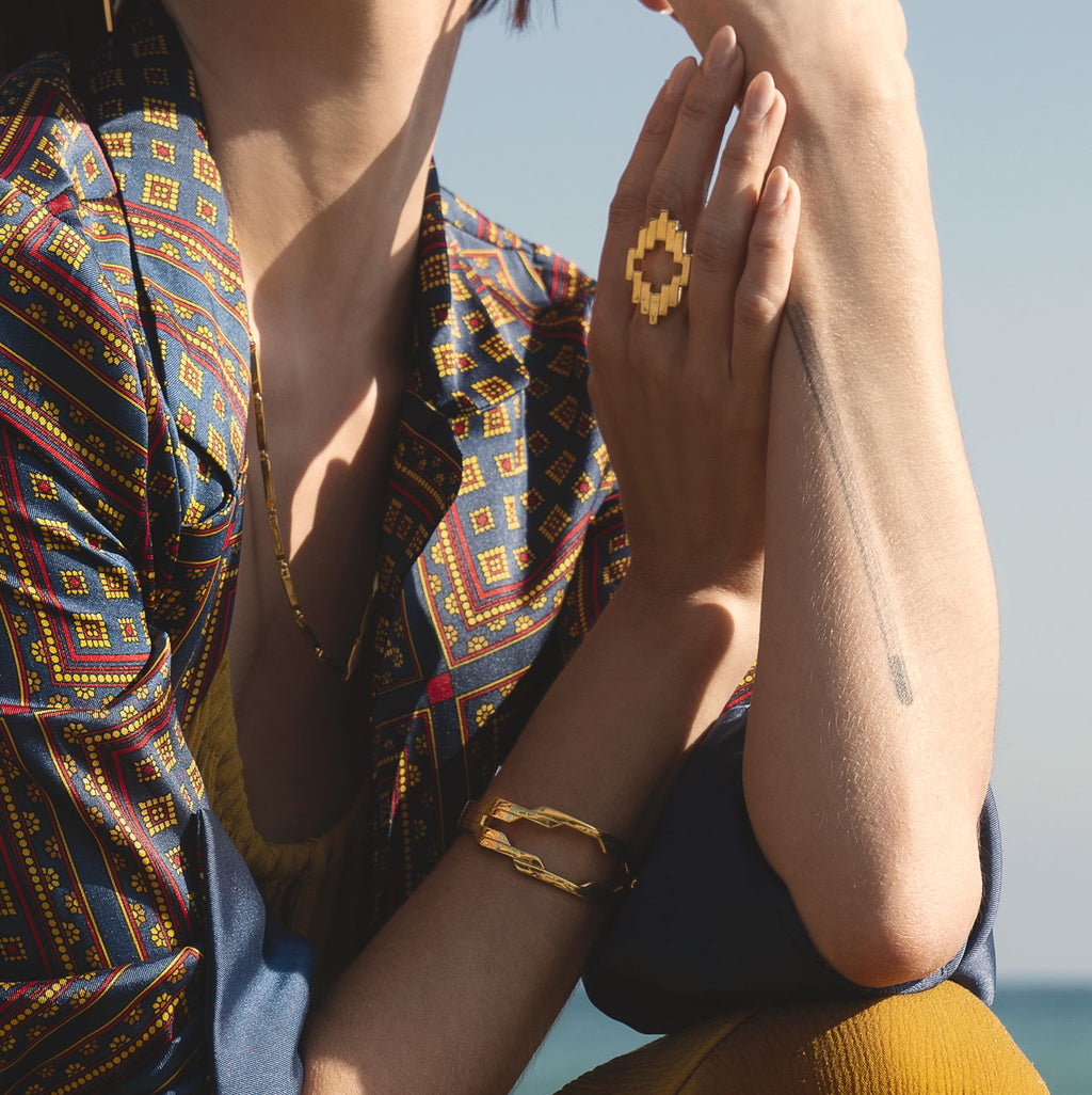 Aura Ring and Aura Cuff bracelet on the arm of woman.