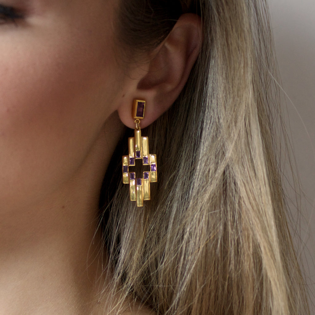 Close up of woman wearing the Amethyst and Gold Aurora Earrings